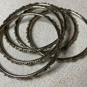 Hoop bracelets in silver tone with microgranulation - waves